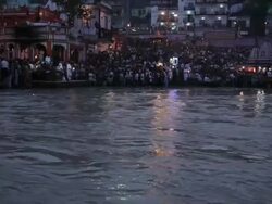 Pilgrims doing aarti at riverbank, Ganges River, Haridwar, Uttarakhand, India Stock Footage