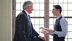 DOLLY: Two businessmen in discussion Stock Footage