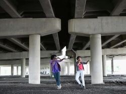 MS Young male and female couple dancing outside in urban area together having fun and smiling / Minneapolis, Minnesota, United States Stock Footage