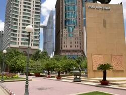 MS TU Statue of Trung Hung Dao and Modern building in Ho Chi Minh City / Quan 1, Ho Chi Minh City, Vietnam Stock Footage