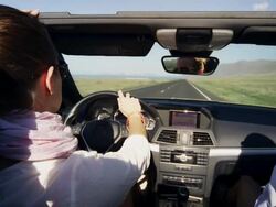 Woman enjoys car ride Stock Footage