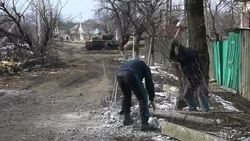 Pro Russian Militias smashing up concrete News Clip