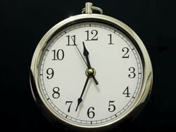 Time lapse Clock with Time going Forwards then Backwards Stock Footage