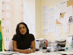 MS PAN Man dressing green outfit with yellow cape, superhero place his hand on business woman shoulder while looking towards / Seattle, Washington, United States  Stock Footage