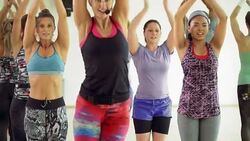 Instructor leading exercise class in gym studio Stock Footage