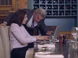 MS PAN Businessman discussing with digital tablet in restaurant Stock Footage