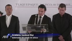 VOICED : Mexico: Familiares lloran a 15 policias muertos News Clip