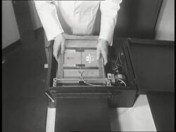 Doctors process an X-ray of a woman's hand. News Clip