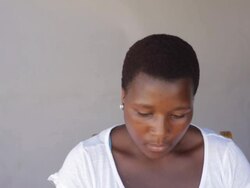 African woman looking down, getting a little fright Stock Footage