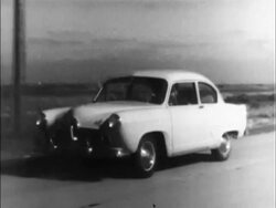 Montage: 1951 Kaiser Deluxe and Henry J driving Stock Footage