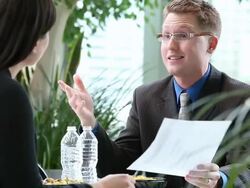  PAN Young business associates discussing document / Seattle, Washington, United States Stock Footage