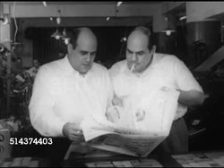 1952: CAIRO, EGYPT: Egyptian Arabic newspaper office building of 'Akhbar El Yom', WS Sign on top, owners Mustafa Amin & twin brother Ali checking newspaper. VS Workers gathering up folded newspapers from machine. Instructional Video