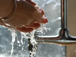 CU hands washing under tap, UK Stock Footage