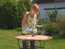 Coating the garden table Stock Footage