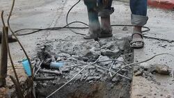 Labor people Drilling asphalt road Stock Footage