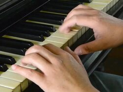 Close up of male hands playing piano Stock Footage