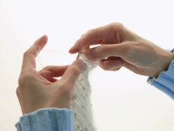 MS Woman Knitting with white wool / Shibuya-ku, Tokyo, Japan Stock Footage