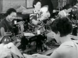 B/W 1934 women sewing at machines in WPA garment factory / documentary Stock Footage