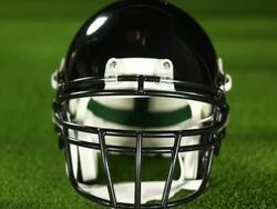 Dolly towards American Football Helmet - HD &amp; PAL Stock Footage