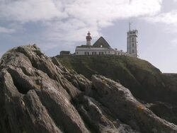WS Lighthouse on rock at near of sea / Plougonvelin, Brittany, France Stock Footage