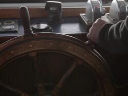 Captain mans ships wheel, TS on exhaust pipes of fishing boat Stock Footage
