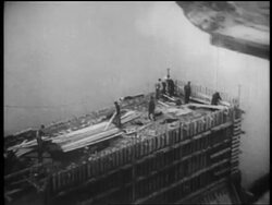 B/W 1930s AERIAL men building dam / Tennessee River Valley Stock Footage