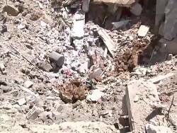 People in Gaza walking amid rubble News Clip