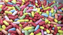 A scoop scoops out multicolored candies. Stock Footage