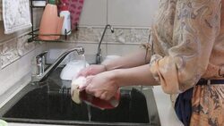 Blond woman washes the plates Stock Footage