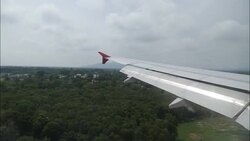 Inside massager look wing of Airplane landing Stock Footage