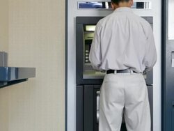 Man withdrawing money from cash machine Stock Footage
