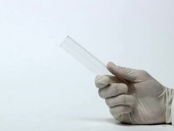 Test for hydrogen gas. A lit splint is held to the gas, igniting it with a characteristic squeaky pop Stock Footage