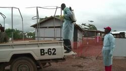 CLEAN : Sierra Leone funeral workers take risks burying Ebola dead News Clip