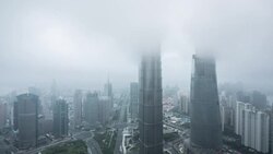 fog covering Shanghais skyscrapers Stock Footage