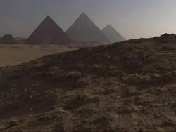 Wide Shot, crane - The Great Pyramids rise above the Giza Plateau / Egypt Stock Footage