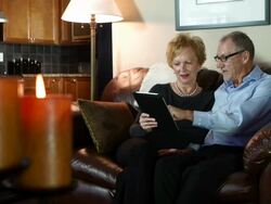 Seniors research on digital tablet, rack focus Stock Footage