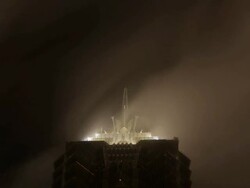 T/L LA CU Rooftop of Jin Mao Tower with clouds passing by in background at night/ Shanghai, China Stock Footage
