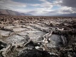 WS LA POV View of Dry Cracked Earth and Salt Flats / Death Valley NP, California, United States  Stock Footage