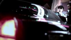 Chauffeur stands by as celebrity couple climbs out of limousine at Hollywood premiere at awards show Stock Footage