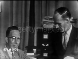1952: KEFAUVER CAMPAIGN HEADQUARTERS PRESS ROOM: Senator Estes Kefauver sitting talking w/ LIFE Washington correspondent Frank McNaughton, SOT on Portland returns, Estes giving LIFE reporter compliment, spot checks 60% , Estes turns to Nancy, proud. Instructional Video