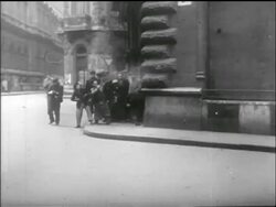 B/W 1956 crowd of civilians huddled against building firing guns / Hungarian uprising Stock Footage