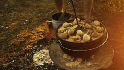 Preparing rustic dark bread, baking in dutch oven Stock Footage