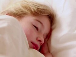 CU Little girl lying awake in her bed / Lamy, New Mexico, United States Stock Footage