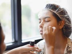 apply a tint on the apples of cheeks Stock Footage