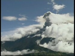 WA white cloud partially covering erupting volcano, zoom out, Mount Tunguragua, Ecuador Stock Footage
