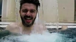 Young man in the pool at sunny day Stock Footage