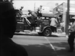 B/W 1963 PAN fire truck on street heading to civil rights demonstration / Alabama / newsreel Stock Footage