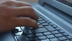 Unrecognizable person using laptop Stock Footage