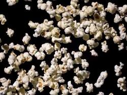 HD Super Slow-Mo: Popcorn Falling Over Black Background Stock Footage