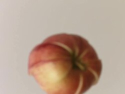 Apple free-falls to table and slices separate Stock Footage